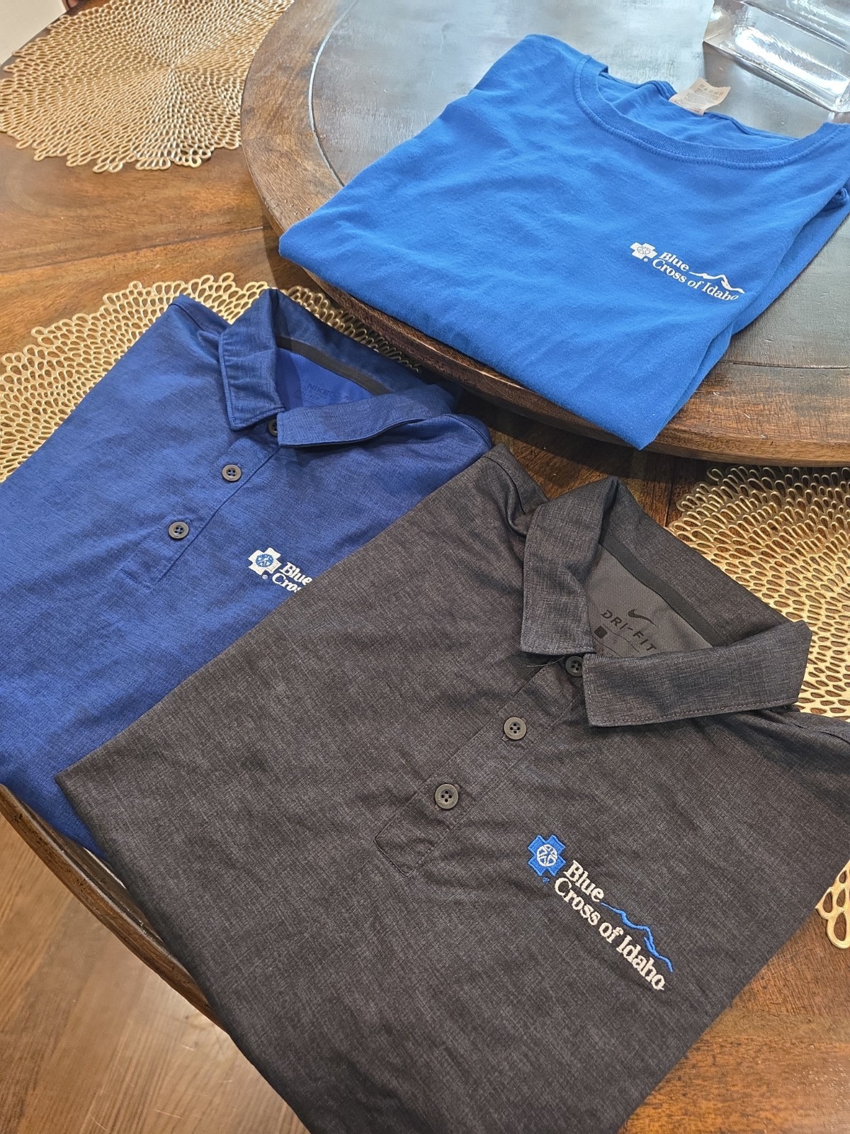 Blue cross of idaho t shirt and two Size Large Polo Shirts
