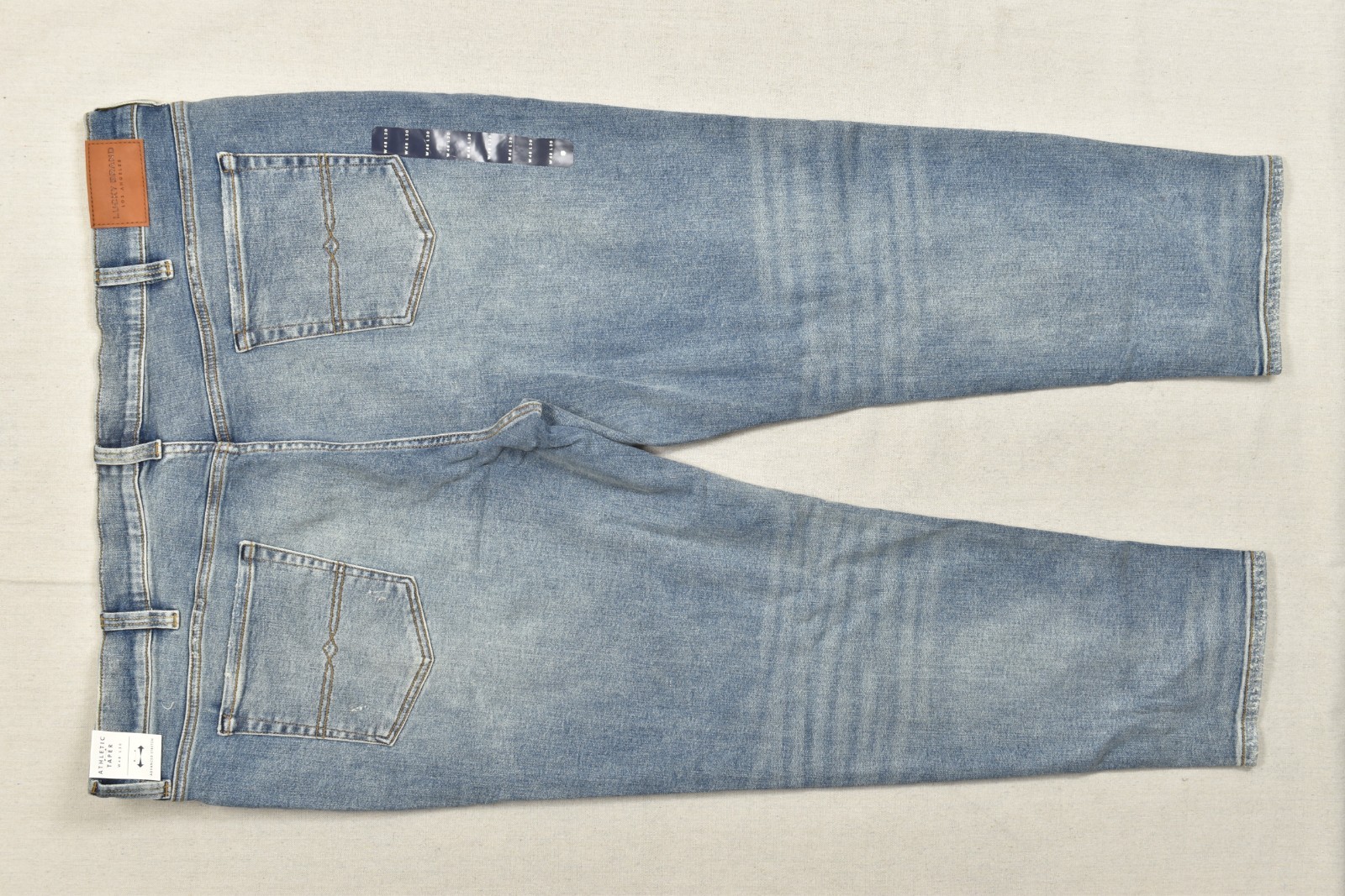 Lucky Brand Men’s Athletic Taper Denim Jeans Light Wash Blue Stretch 48×30 NEW