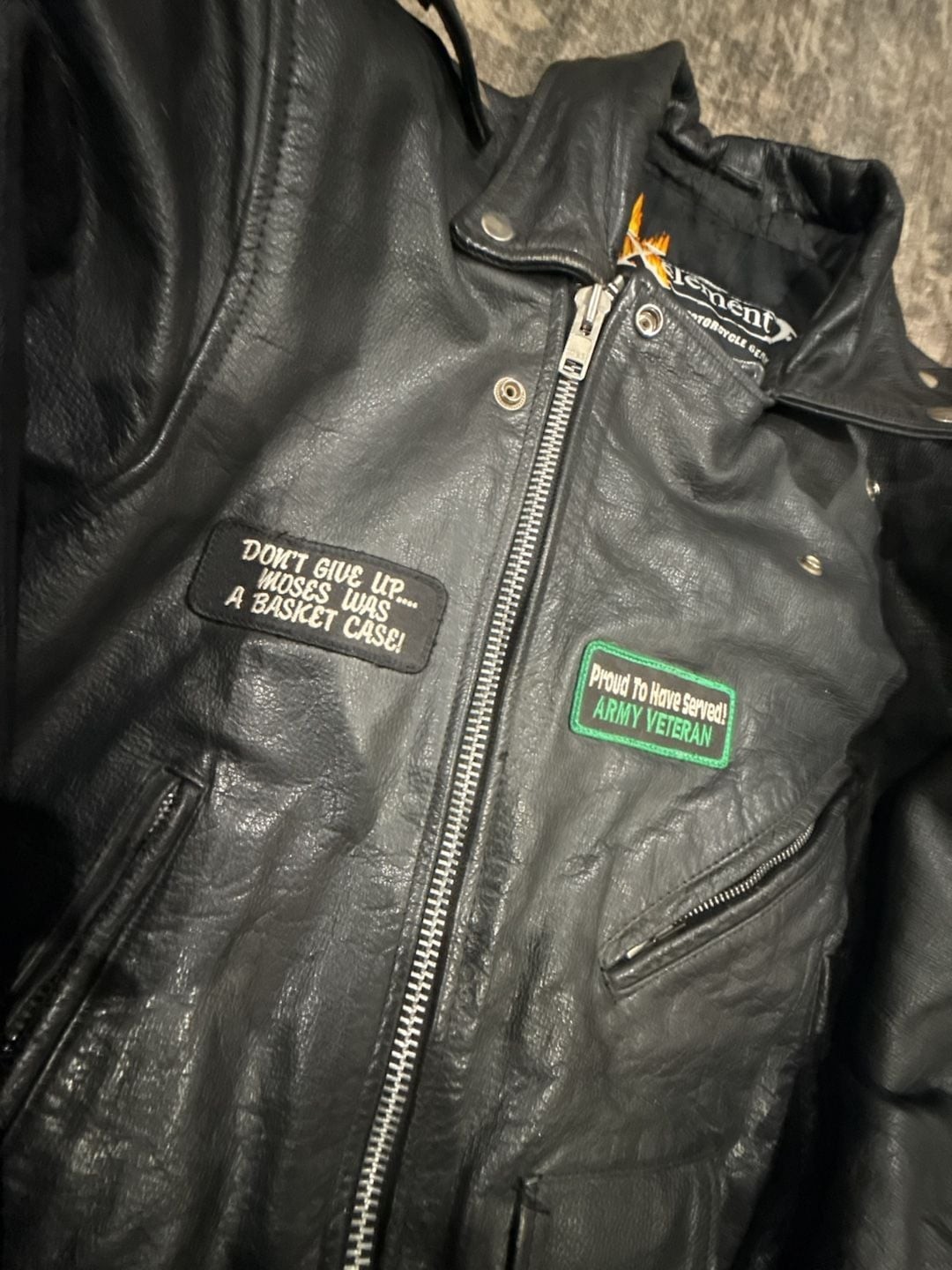 Xelement Men’s Leather Motorcycle Jacket with Veteran and Biker Patches
