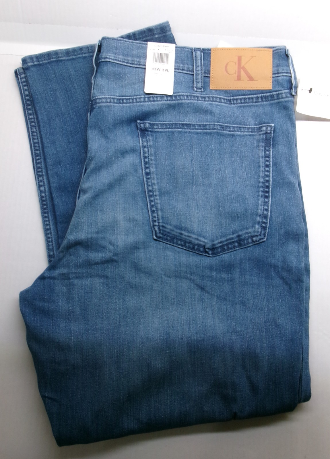 Calvin Klein Straight Leg Jeans sits below waist easy fit hip &thigh Medium Wash