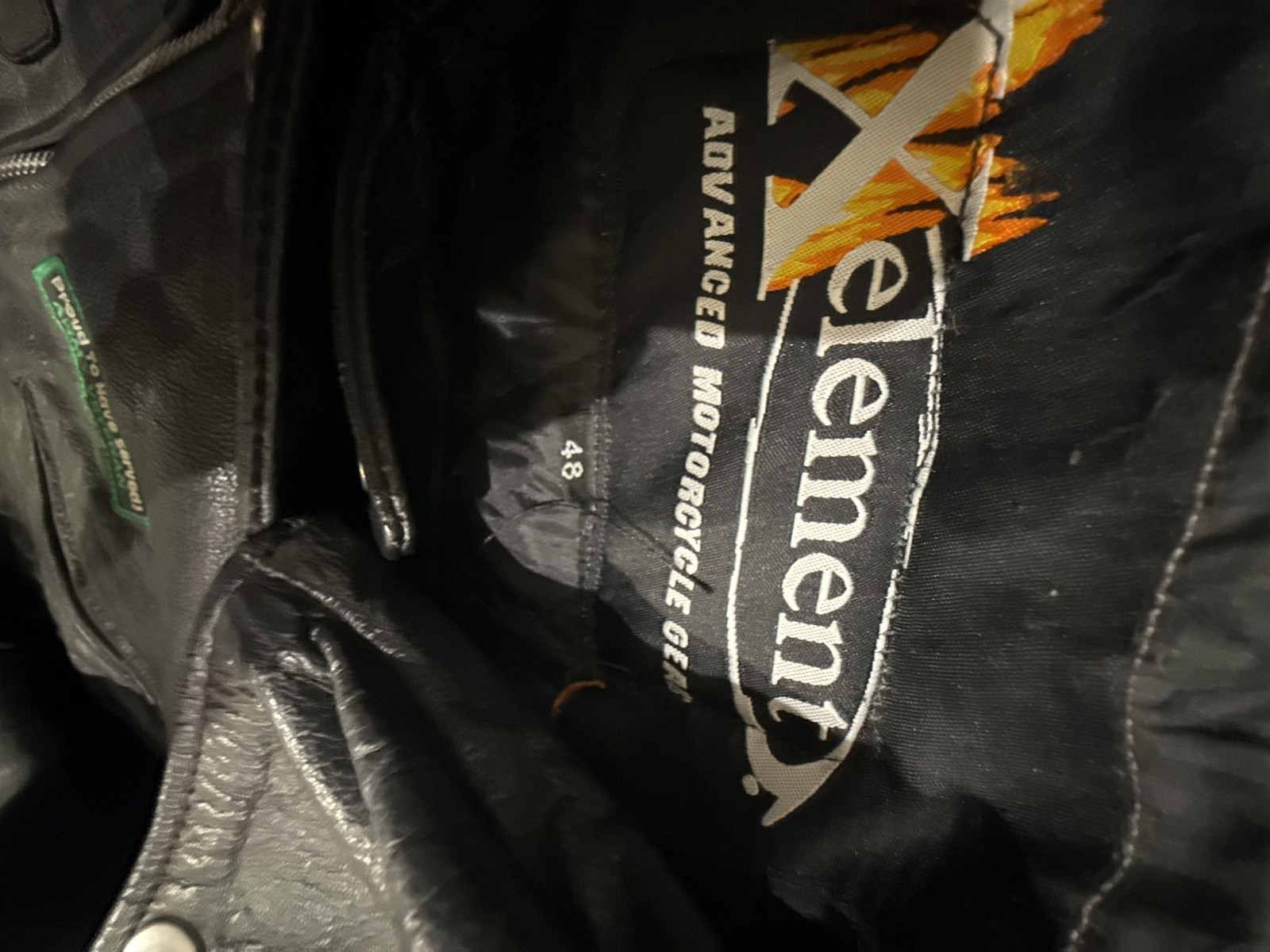 Xelement Men’s Leather Motorcycle Jacket with Veteran and Biker Patches
